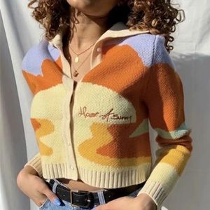 Very cute multi colored cardigan great alone or layered with dress or top